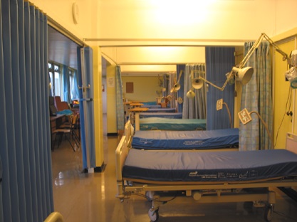 hospital ward with folding fabric room dividers